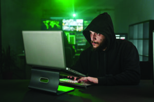 Fig3-hooded-hacker-working-on-computer